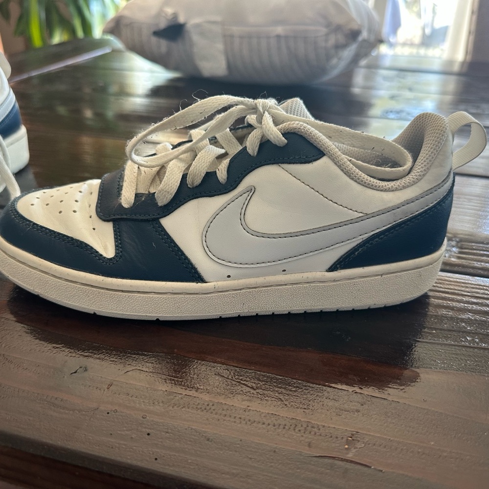 Two pairs of  Nike sneakers